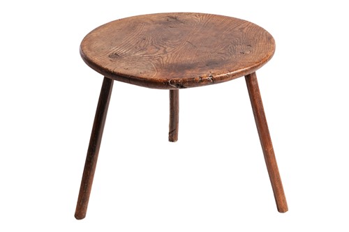 Lot 88 - A 19th-century primitive figured elm circular...