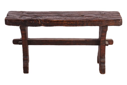 Lot 117 - A primitive vernacular oak/elm form stool,...