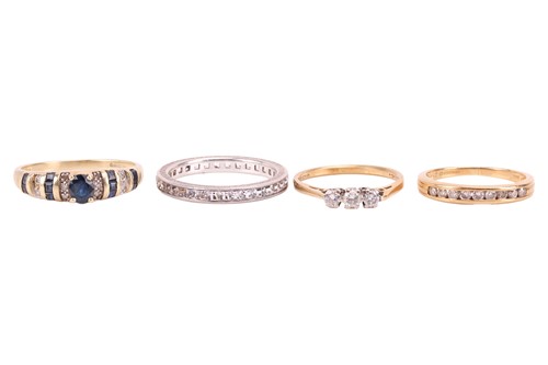 Lot 87 - A full hoop diamond eternity ring, set with a...