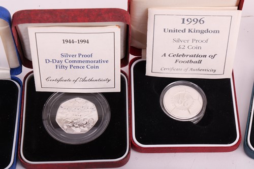 Lot 145 - A collection of twelve cased silver proof...