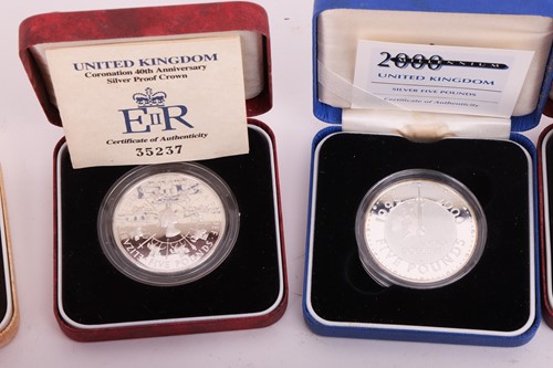 Lot 145 - A collection of twelve cased silver proof...