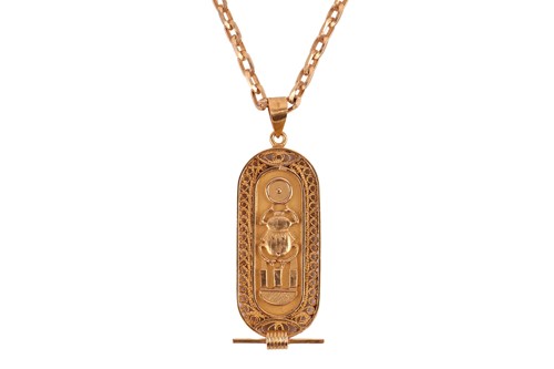 Lot 104 - An Egyptian cartouche pendant on a cable link...