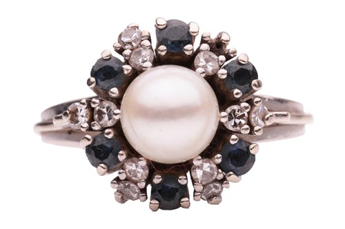 Lot 65 - A gem-set cluster ring, centred with a round...