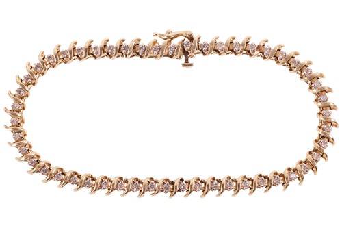 Lot A diamond line bracelet of spiral design,...