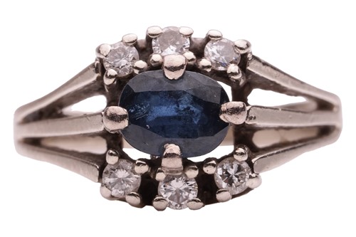 Lot 46 - A sapphire and diamond ring, centred with an...