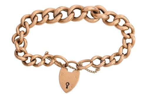 Lot A curb chain bracelet with a heart padlock...