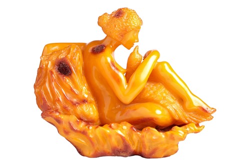 Lot 194 - A carved Amber (reconstituted Baltic ?) figure...