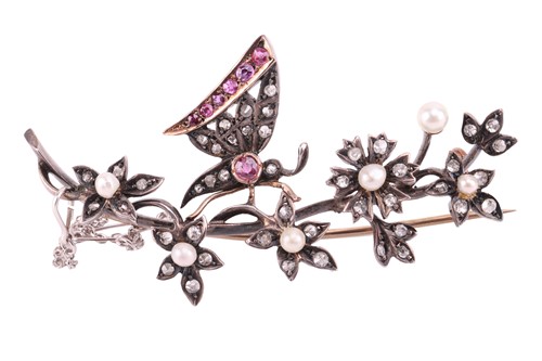 Lot A Victorian gem-set floral brooch, depicting a...