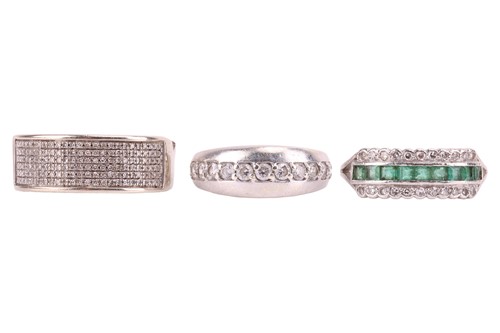 Lot 87 - Three gem set rings; One emerald and diamond...