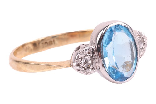 Lot 134 - A blue topaz and diamond ring, bezel-set with...