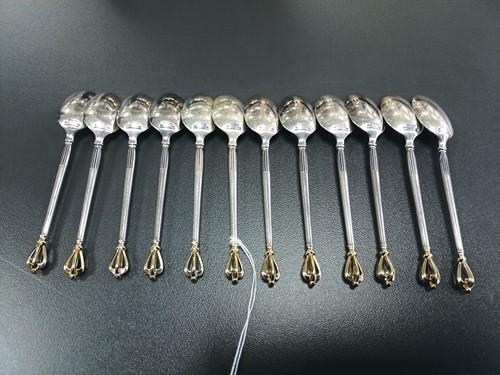 Lot 41 - A set of twelve Danish teaspoons and cake...