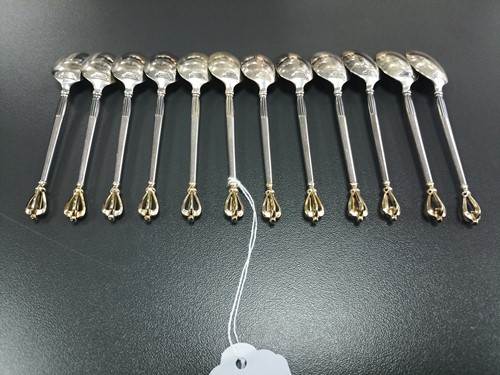 Lot 41 - A set of twelve Danish teaspoons and cake...