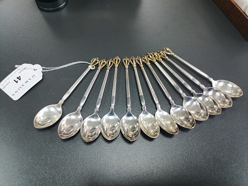 Lot 41 - A set of twelve Danish teaspoons and cake...