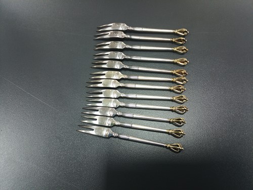 Lot 41 - A set of twelve Danish teaspoons and cake...