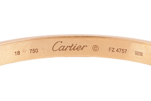 Lot Cartier - a 'LOVE' bangle in 18ct yellow gold,...