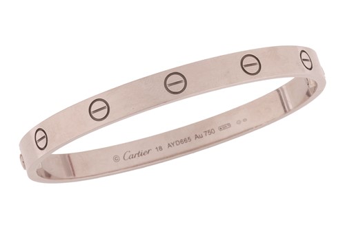 Lot Cartier - a 'LOVE' bangle in 18ct white gold,...