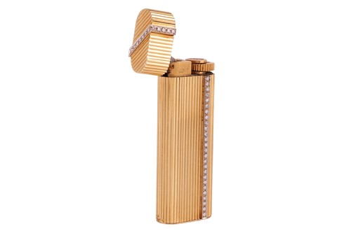 Lot Cartier - a gas lighter of rounded rectangular...