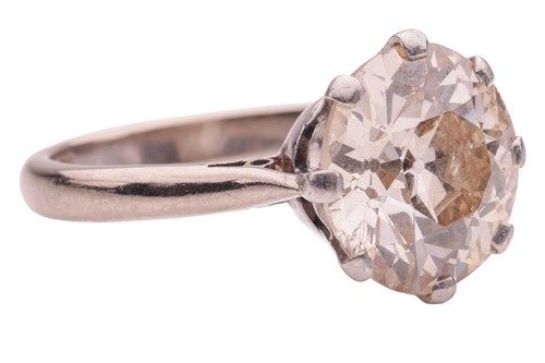 Lot 229 - An old-cut diamond solitaire ring, claw-set...