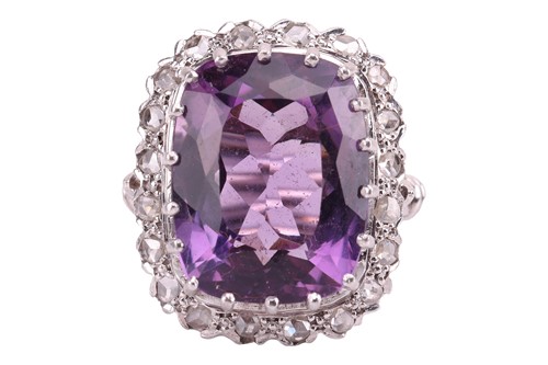 Lot 29 - An amethyst and diamond dress ring, the claw...