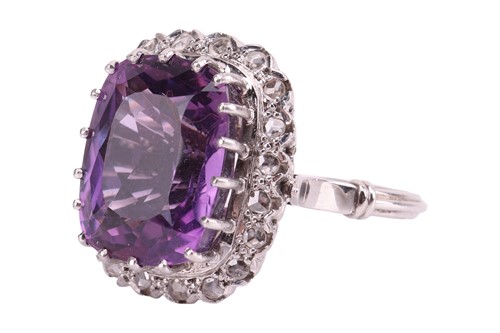 Lot 29 - An amethyst and diamond dress ring, the claw...