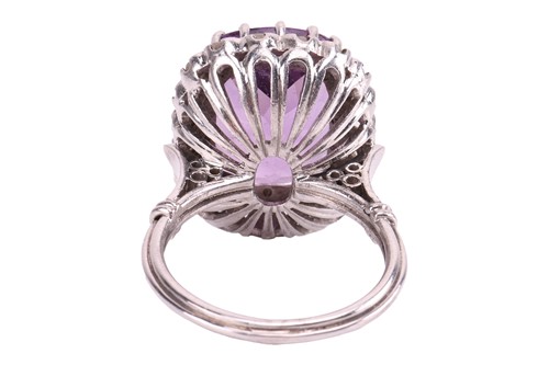Lot 29 - An amethyst and diamond dress ring, the claw...