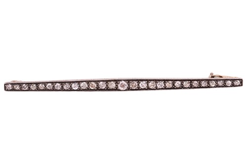 Lot 104 - An early 20th century diamond bar brooch, set...