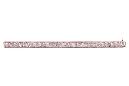 Lot 27 - A diamond set bar brooch, pavé-set with twenty-...