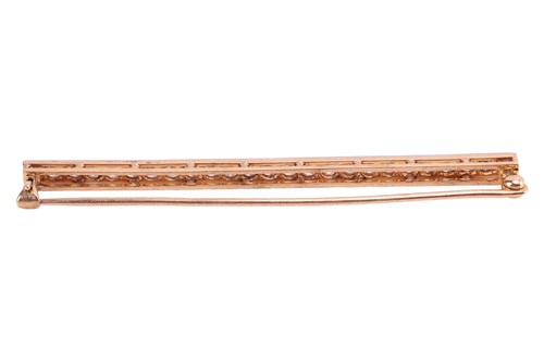 Lot 27 - A diamond set bar brooch, pavé-set with twenty-...