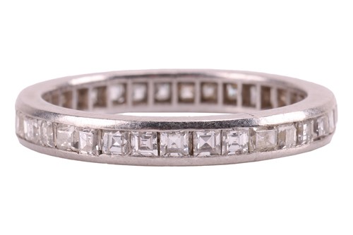 Lot 22 - A diamond-set eternity ring, featuring a...