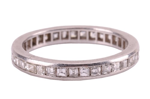 Lot 22 - A diamond-set eternity ring, featuring a...