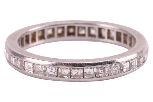 Lot 22 - A diamond-set eternity ring, featuring a...