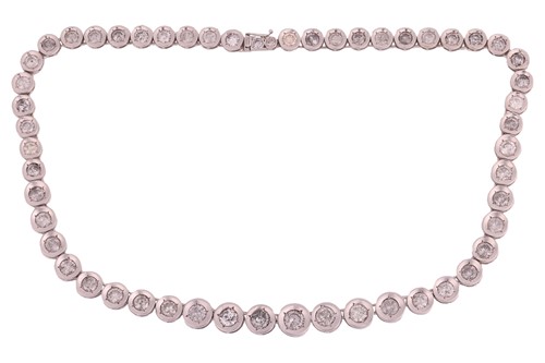 Lot 116 - A diamond Riviere necklace, set with an array...