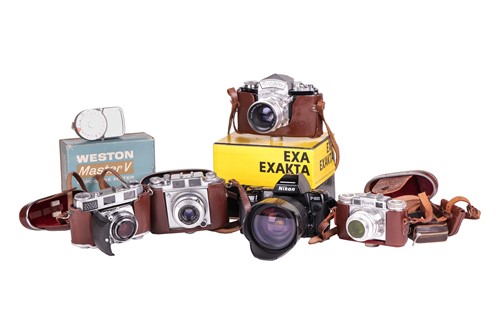 Lot 162 - A collection of vintage SLR cameras and...