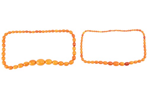 Lot 35 - Two amber bead necklaces; a row of...