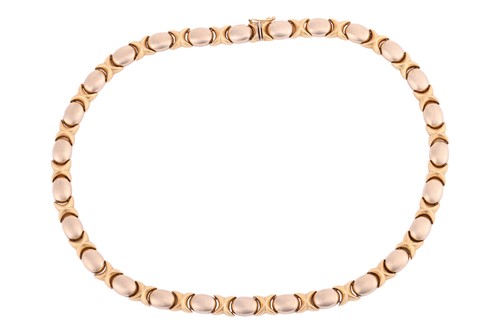 Lot 51 - A two-toned link necklace of modular design,...