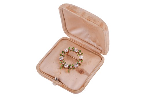 Lot 222 - Marcus & Co. - a diamond and demantoid garnet...