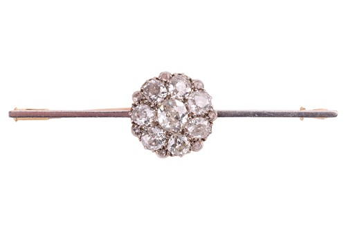 Lot 87 - A diamond cluster bar brooch, with an...