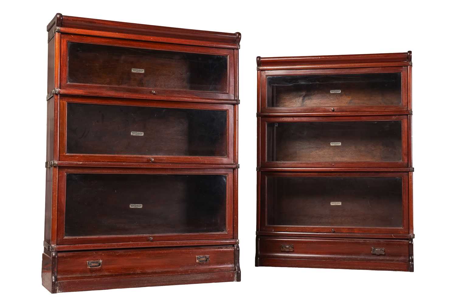 Lot 101 - A pair of Globe Wernicke mahogany...
