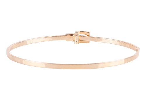 Lot 94 - A diamond-set hinged bangle in 18ct gold, of...