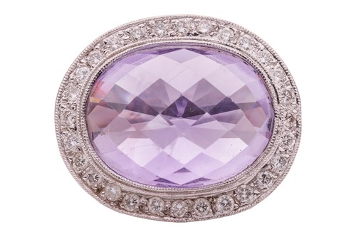 Lot 235 - An amethyst and diamond cocktail ring in 18ct...