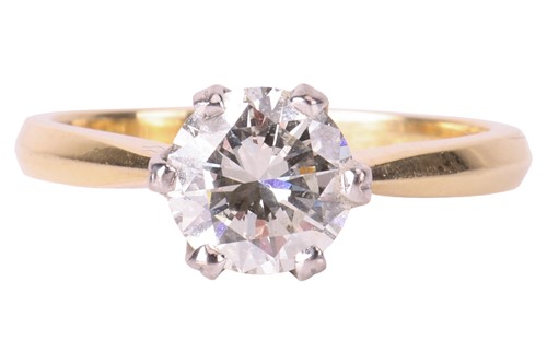 Lot 65 - A diamond solitaire ring, claw-set with a...