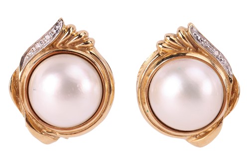 Lot 23 - A pair of mabe pearl earrings, featuring...