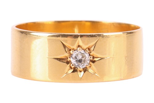 Lot 84 - A diamond-set ring in 18ct gold, star-set with...