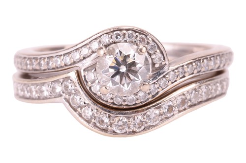 Lot 10 - A diamond engagement ring and wedding band set;...