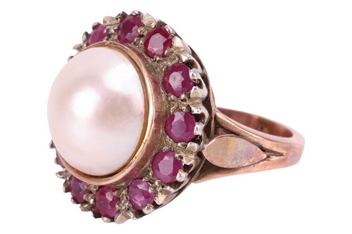 Lot 122 - A Mabé pearl and ruby cocktail ring, centred...