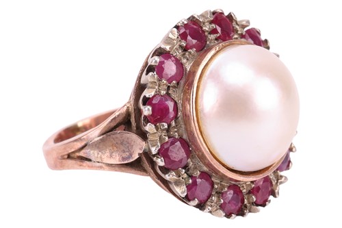 Lot 122 - A Mabé pearl and ruby cocktail ring, centred...