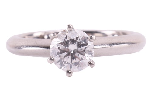 Lot 201 - A diamond solitaire ring in platinum, claw-set...