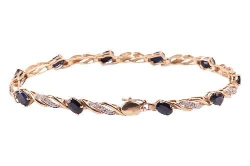 Lot 15 - A gem-set bracelet in 9ct gold, comprising of...