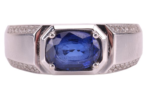 Lot 158 - A sapphire and diamond ring, the central...