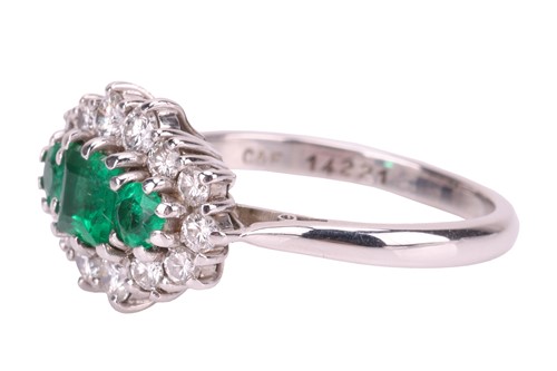 Lot 45 - An emerald and diamond cluster ring in 18ct...